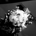 black and white bridal bouquet on car hood