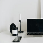 a laptop and mobile phone on the table