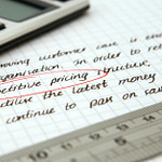 competitive pricing handwritten text encircled on paper