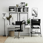 black office rolling chair beside white wooden desk