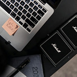 office desk with marshall music equipment and laptop