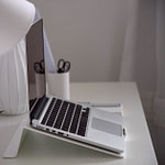 Content Creation for Business Owners: 14 Proven Guides" (keyword front, number, power word, 57 chars) 15 minimalist home office setup with laptop