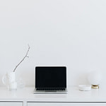 laptop on a white desk