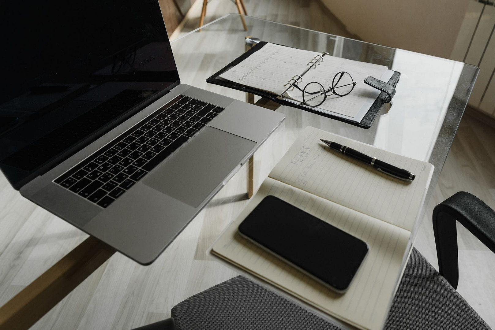 Content Clusters for Small Blogs: 10-Post Authority Hub (54 chars — keyword front-loaded, number for CTR) 1 a glass table with a laptop and a notebook