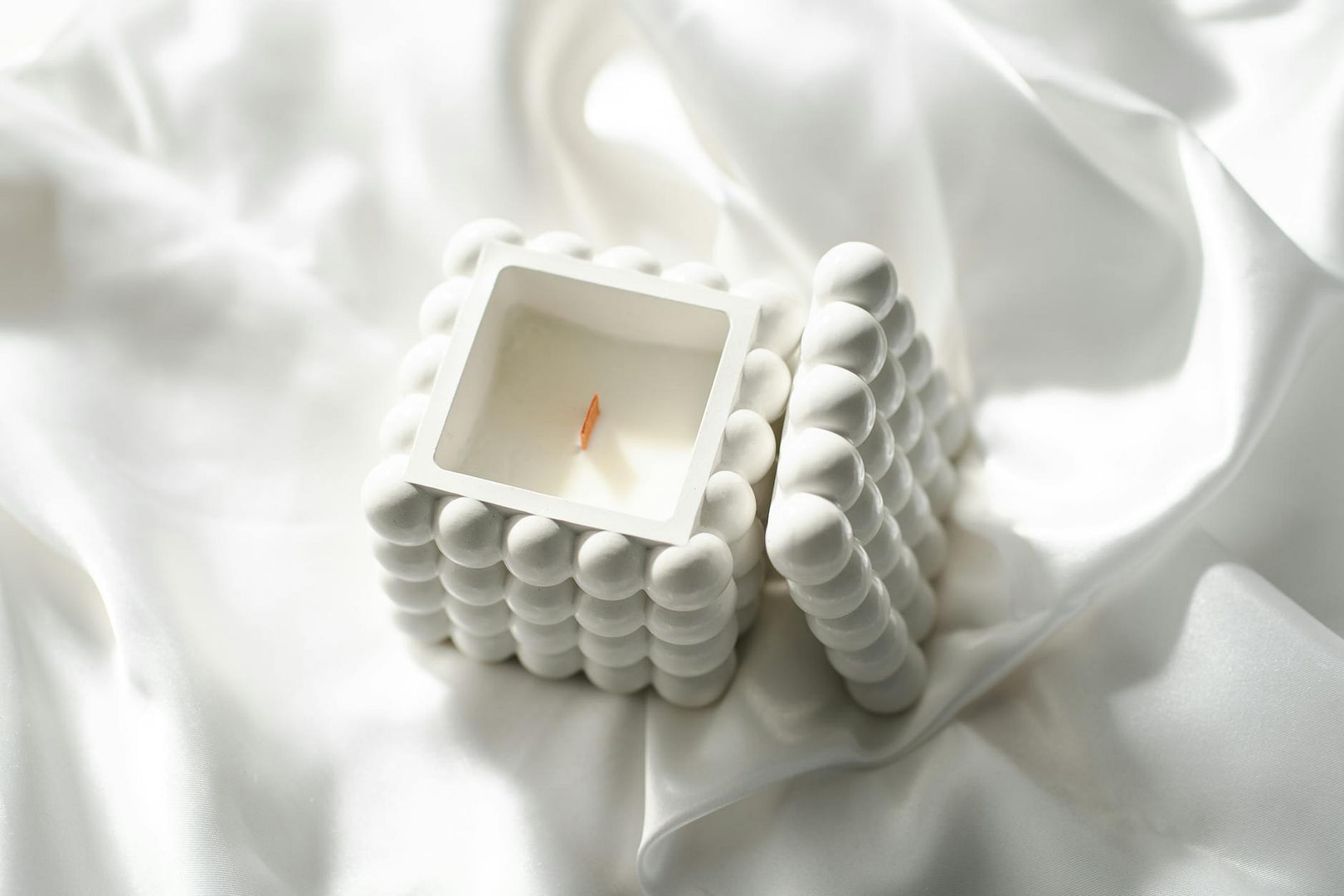 AI-Assisted Content Briefs: Create Faster Blog Outlines That Sound Human 24 elegant white candle on smooth silk fabric