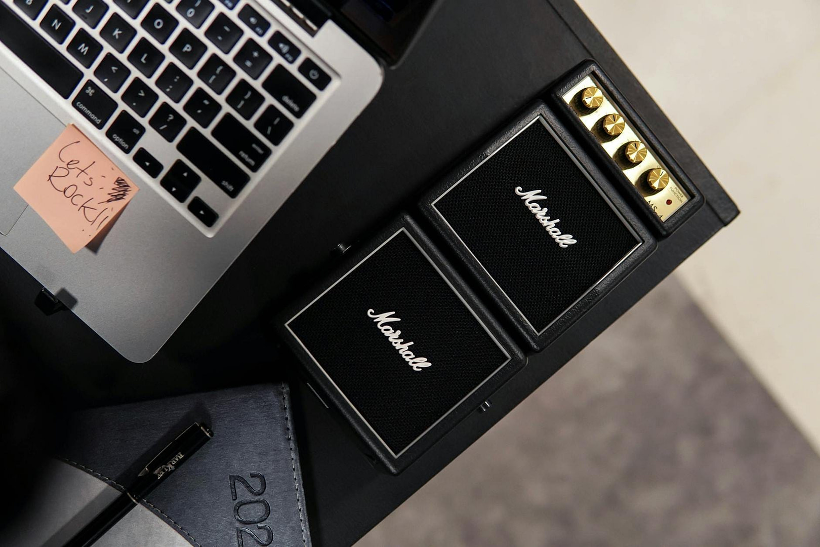 How to Measure Marketing Success: The 5 Numbers That Actually Matter (And the Vanity Metrics Quietly Lying To You) 7 office desk with marshall music equipment and laptop