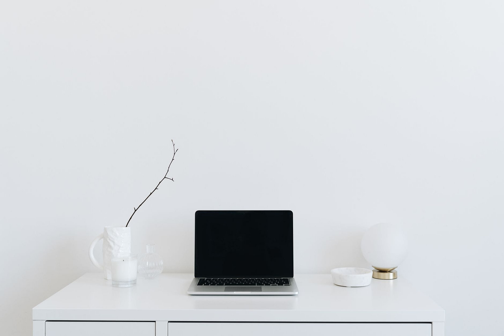 How to Make Money With Digital Marketing in 2026 1 laptop on a white desk