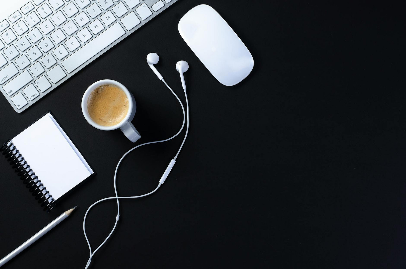 How To Start A Blog With No Experience: 6 Simple Steps To Go Live This Week (Even If You're Not "Techy") 3 close up shot of a keyboard beside a cup of coffee on a black surface