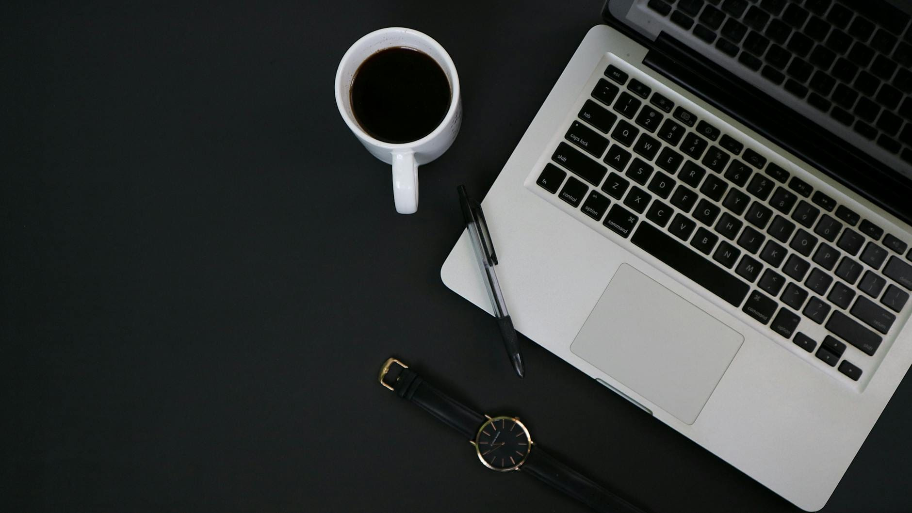 AI Content Briefs: How Solopreneurs Create 10X More Blog Content Without Burning Out 3 a cup of coffee beside a laptop