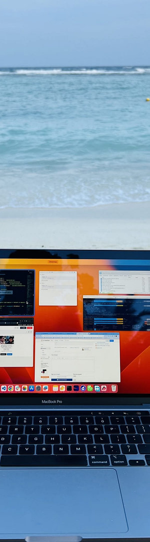 What is Content Marketing: A Strategic Approach to Building Brand Authority and Customer Engagement Through High-Value Content Creation 3 A laptop placed on a wooden table on a sandy beach.