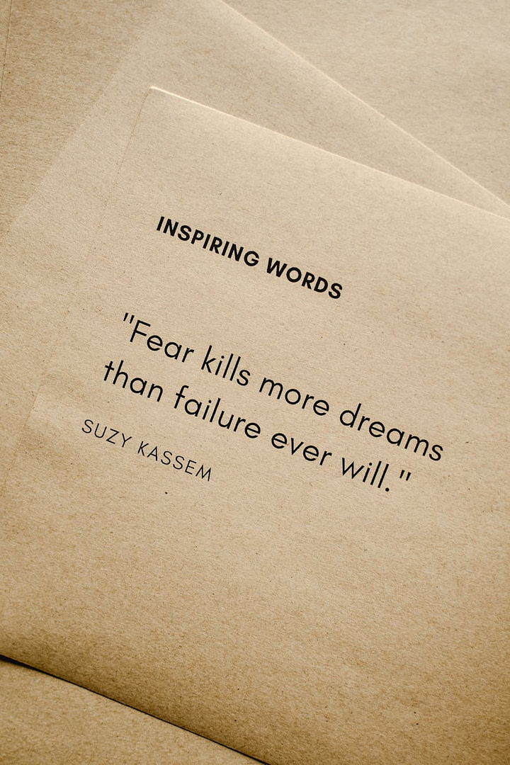 close up shot of inspiring words on a brown paper