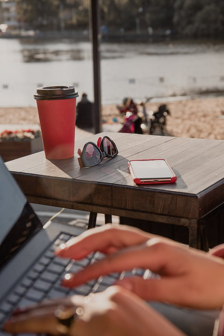 28 Content Upgrades To Grow Your Email List: A Direct-Response Playbook For Niche Digital Marketing Tools That Thrive Leads 1 28 Content Upgrades To Grow Your Email List: A Direct-Response Playbook For Niche Digital Marketing Tools That Thrive Leads a coffee cup on a wooden table with sunglasses and a cellphone