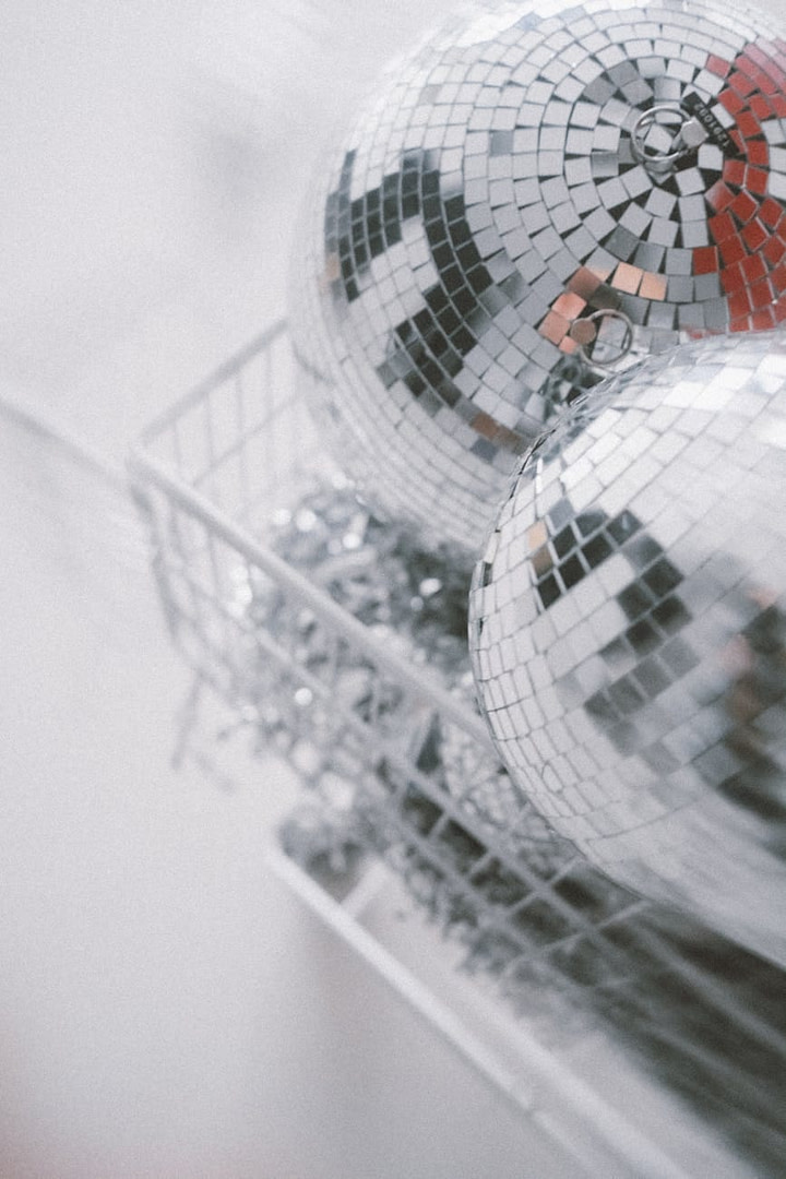 glistening disco balls in basket close up