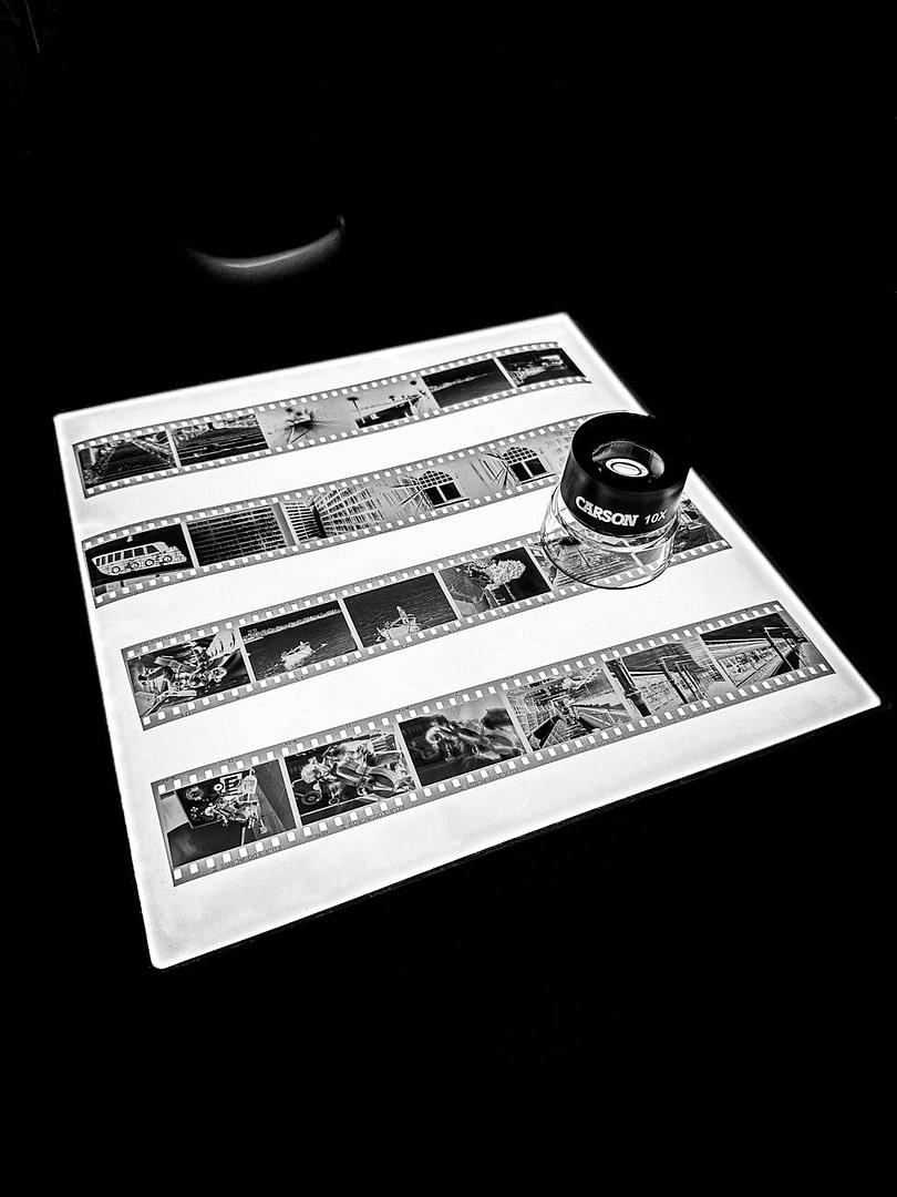 SEO for Topic Experts: Turn What You Already Know Into Google Traffic, Authority, and Subscribers 2 black and white film negatives with loupe