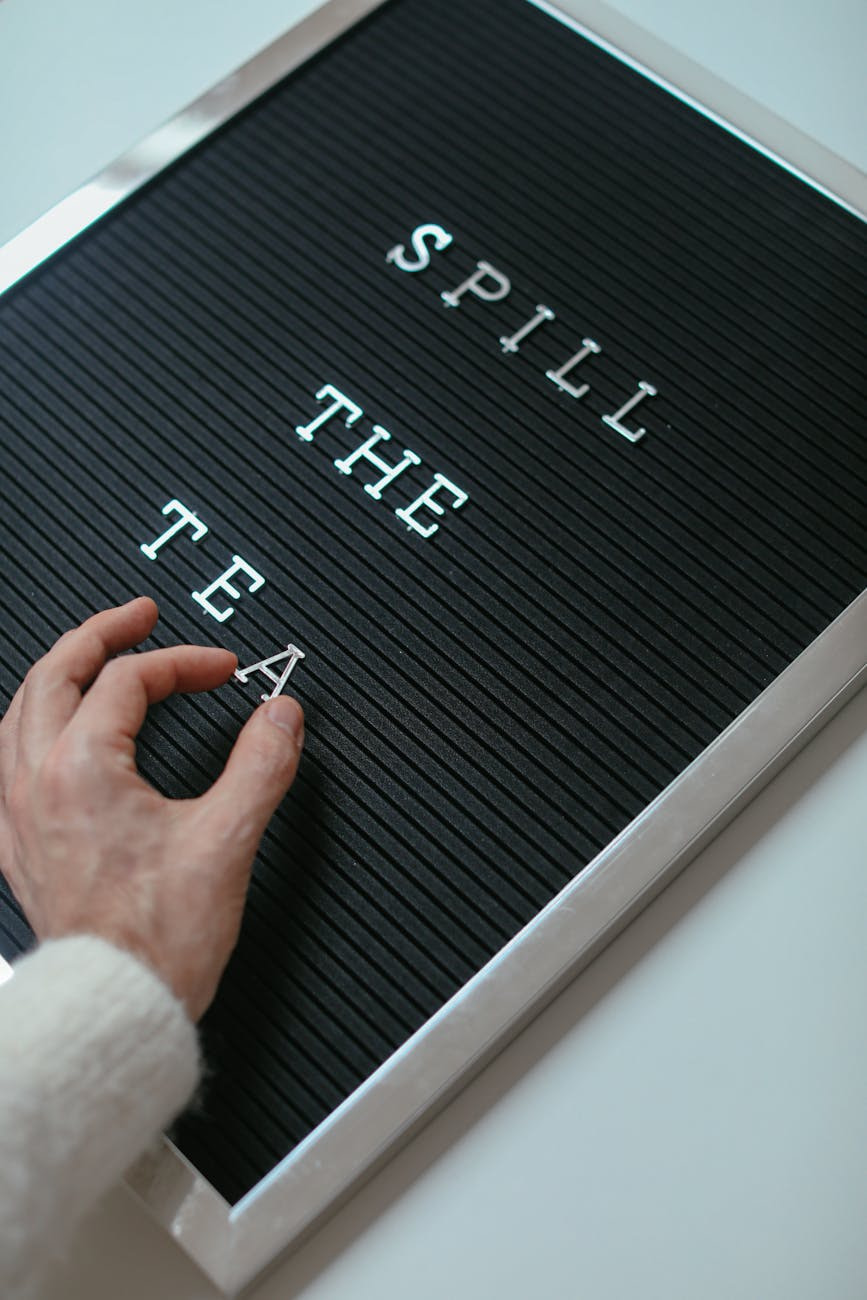 The Top 10 Mistakes to Avoid When Creating Digital Products (And How to Succeed!) a hand putting letters on a letter board